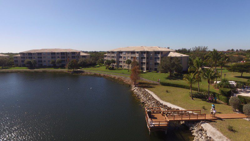 Lakefront apartment complex with dock.